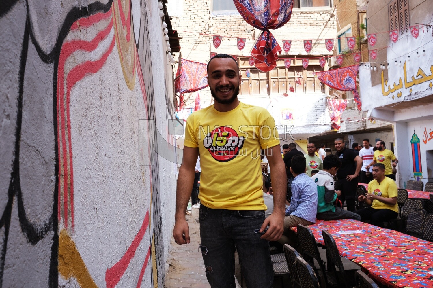 Photo of men organizing the event of iftar Matareya, Ramadan Kareem, preparing their iftar