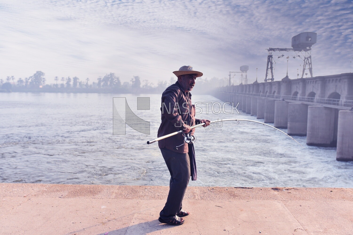 Egyptian man fishing with a hook