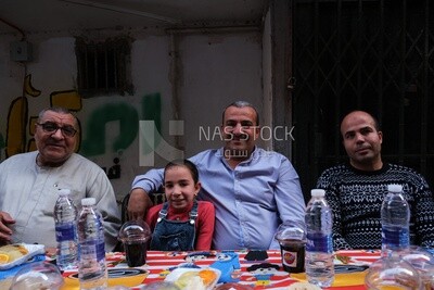 View of people in Matareya sharing their iftar together in the street, Ramadan Kareem, preparing their iftar