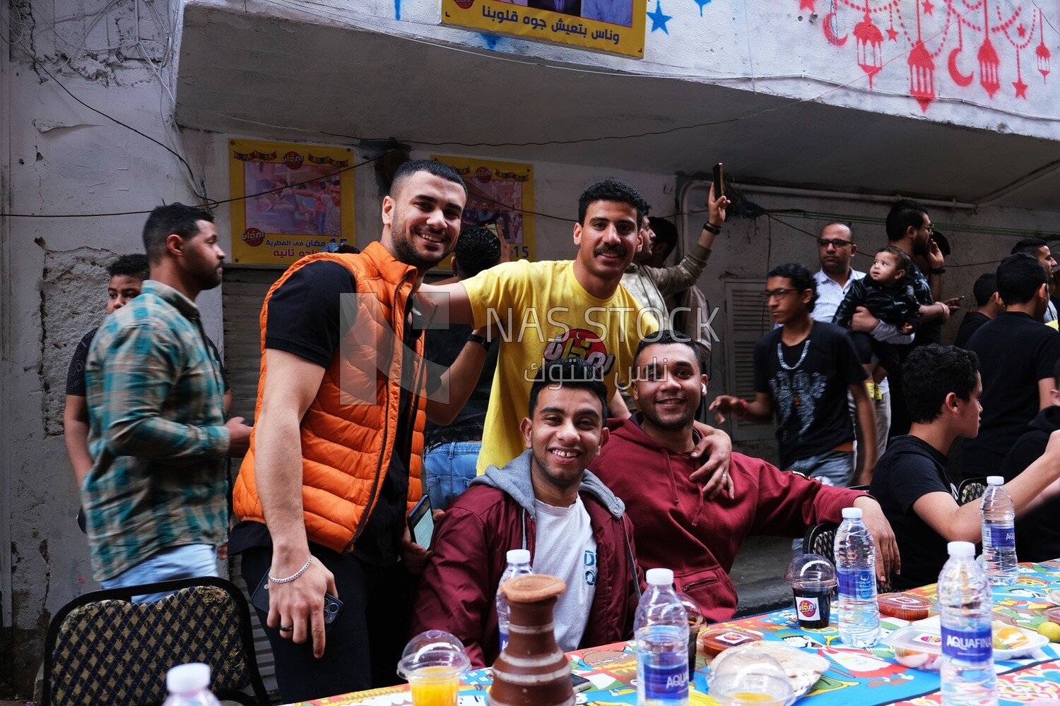 View of people in Matareya sharing their iftar together in the street, Ramadan Kareem, preparing their iftar