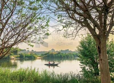 Two fishermen on a fishing boat in the Nile River, Egypt
