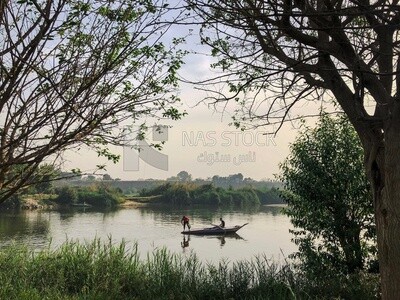 Two fishermen on a fishing boat in the Nile River, Egypt