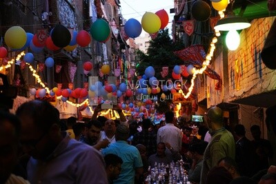View of people in Matareya sharing their iftar together in the street, Ramadan Kareem, preparing their iftar