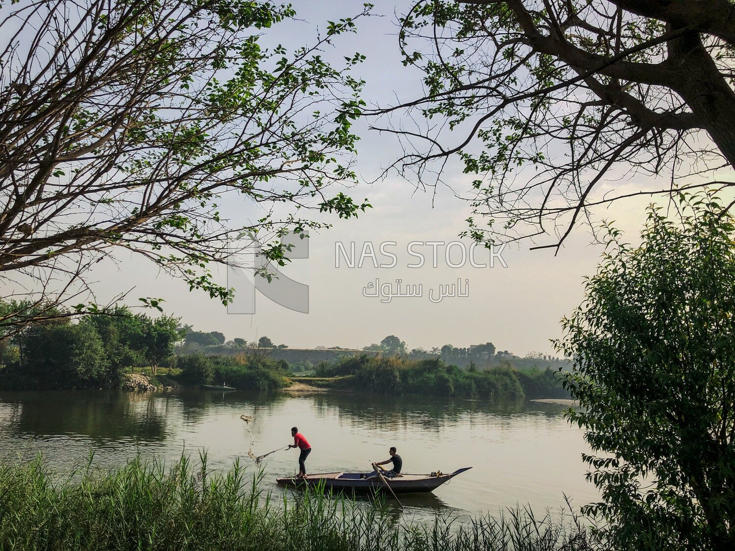 Small boat with fishermen ,Nile River, Egypt