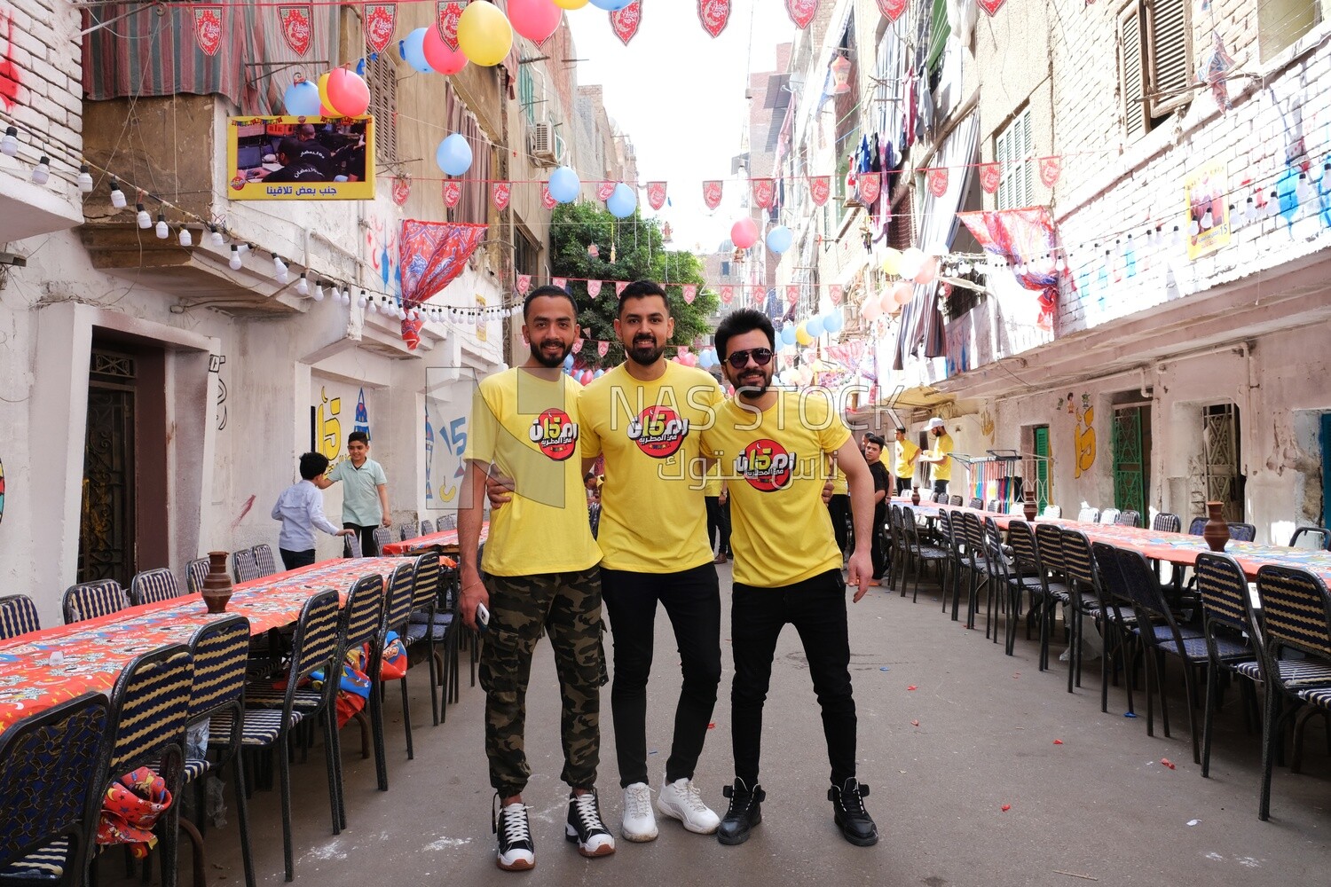 Photo of men organizing the event of iftar Matareya, Ramadan Kareem, preparing their iftar