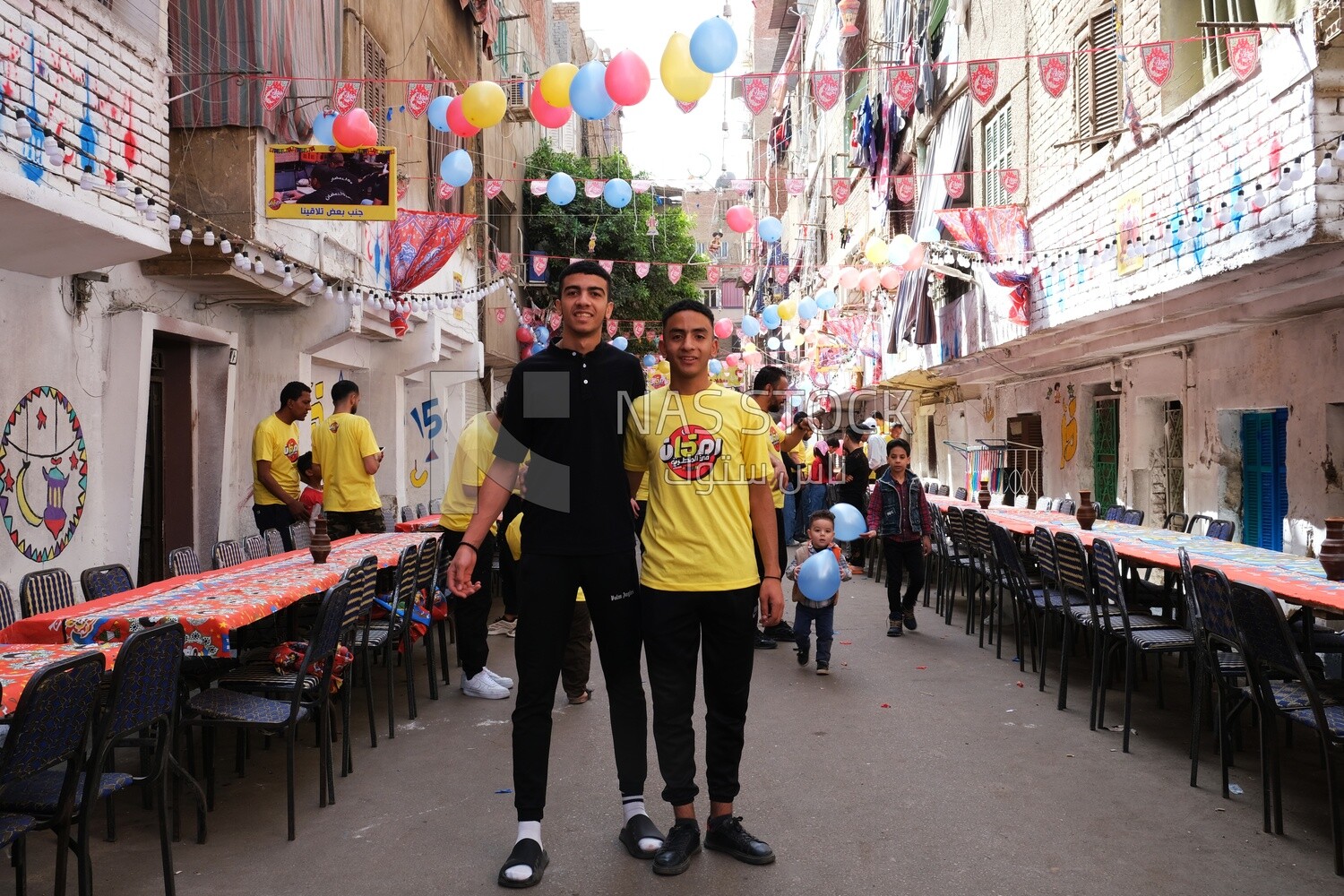 Photo of men organizing the event of iftar Matareya, Ramadan Kareem, preparing their iftar