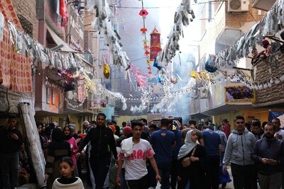 View of people in Matareya sharing their iftar together in the street, Ramadan Kareem, preparing their iftar