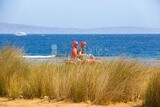 Girl and her friend ride a quad bike