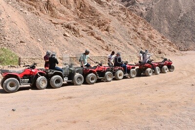 Tourists preparing to take off on quad bikes