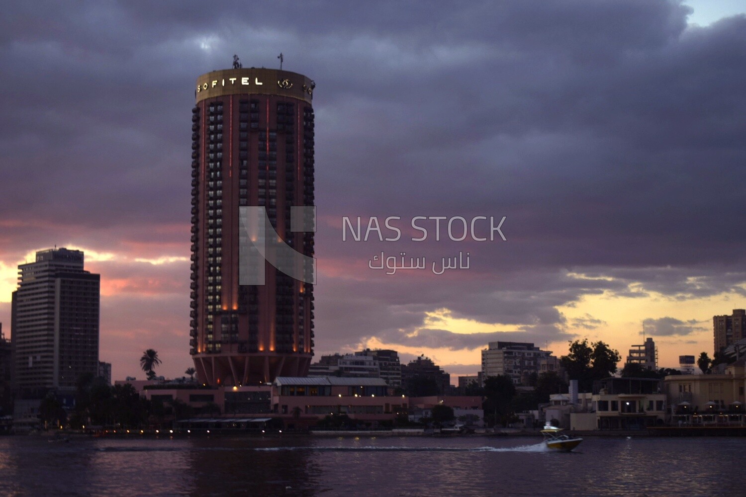 Photo showing the Sofitel El Gezirah Hotel overlooking the Nile River at sunset