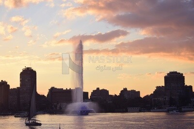 Picture showing the Nile River fountain pumping water with sailboats around it