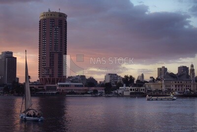 Picture showing a sailboat cruising in the Nile River in front of the Sofitel Hotel