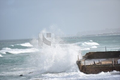 Big waves crash onto the shore