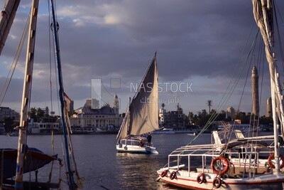 Picture showing the felucca and the Nile boats as they roam and moor in the Nile River in front of the Museum of the Revolutionary Command Council