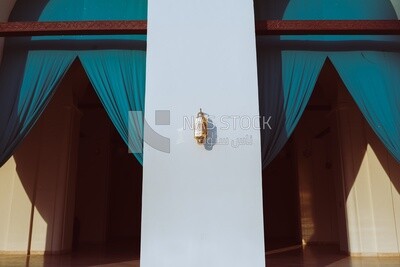 Mosque lamp hanging on pillars at Al-Hakim bi-Amr Allah Mosque in Cairo, Egypt