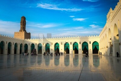 Group of people in the courtyard of Al-Hakim Mosque in Cairo, Egypt