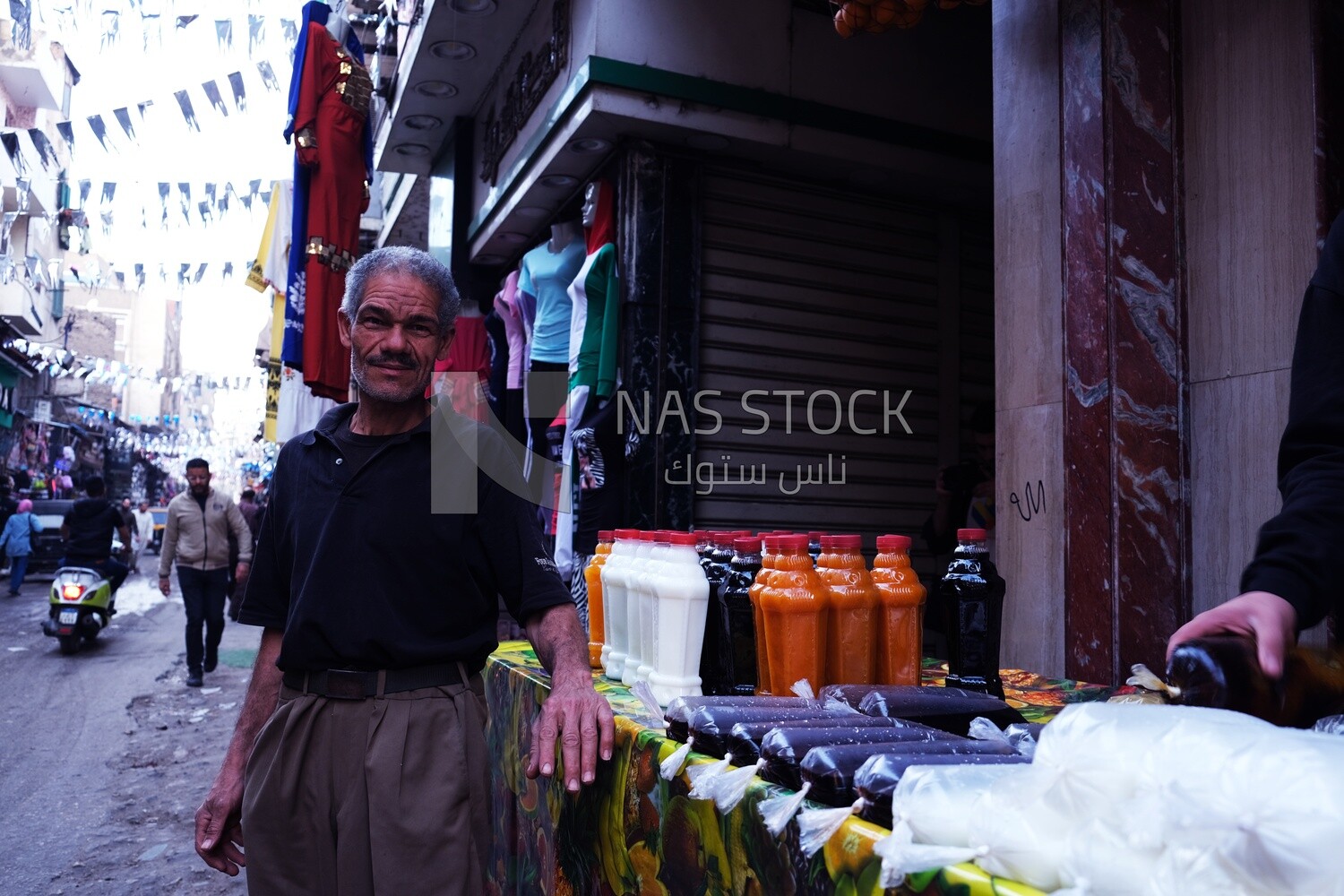 Man standing in front of a juice store, street, delicious drink, Ramadan Kareem