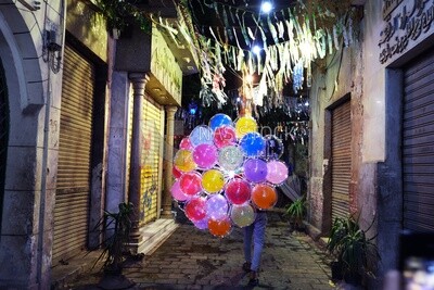 Boy selling luminous balloons in the street, Sayeda Zainab, Ramadan Kareem