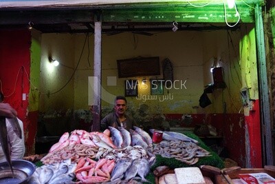 Man standing selling fish in the street, street, work