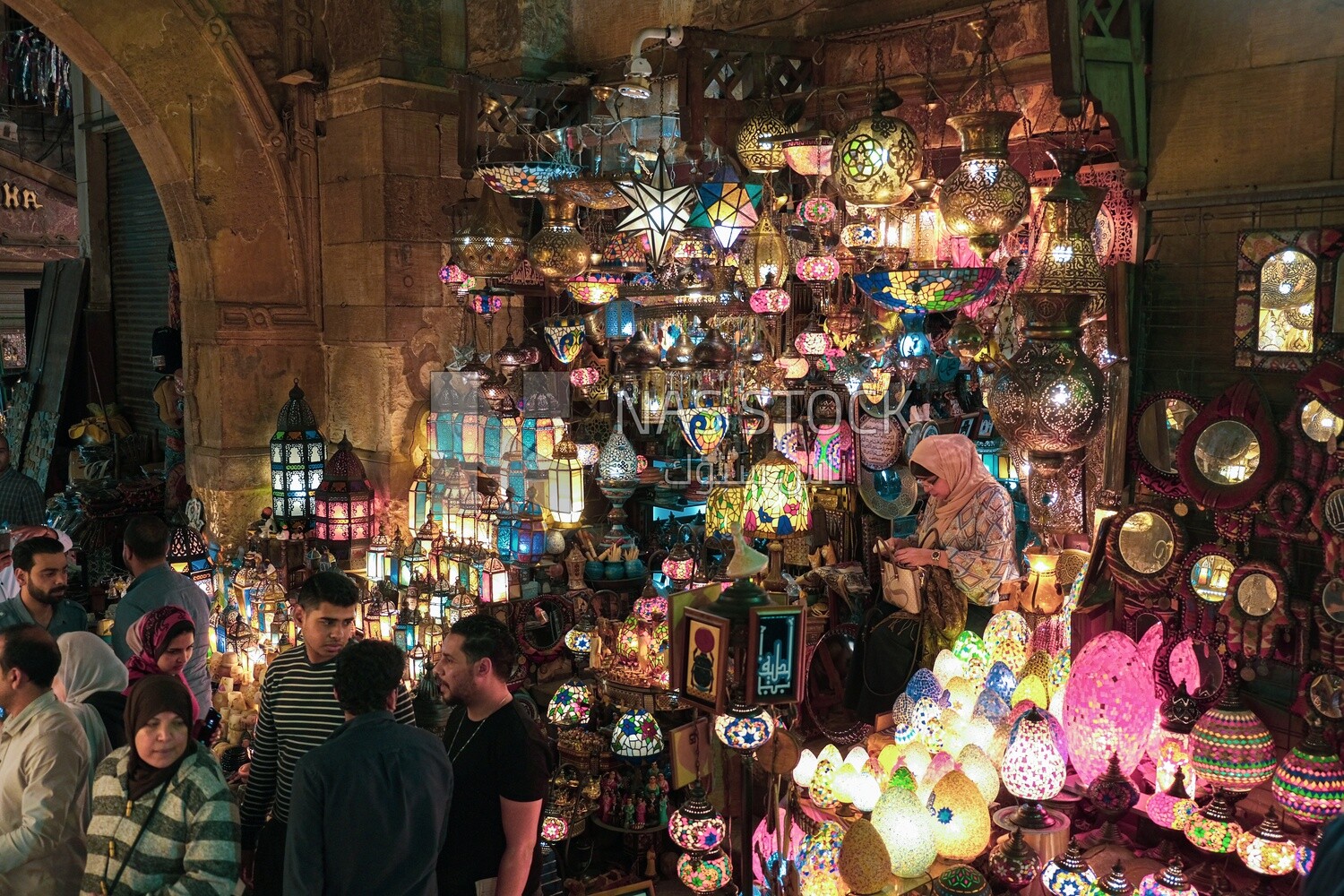 People on Al Moez Street at night, decoration lights