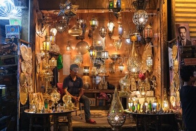 Man sitting in a lights shop in Al Moez street, street,  decorations, Ramadan Kareem