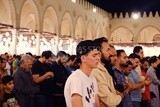 Worshipers praying in a mosque, performing the obligatory prayer in the mosque, worship and draw close to God