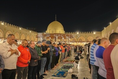 Worshipers praying in a mosque, performing the obligatory prayer in the mosque, worship and draw close to God
