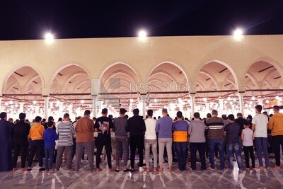 View from the back of the worshipers in the mosque, performing the obligatory prayer inside the mosque, reverence in prayer, performing the obligatory prayer in the mosque, worship and getting closer