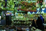 People in a street shop selling lanterns, Hanging lanterns, Sayeda Zainab and Ramadan Kareem.