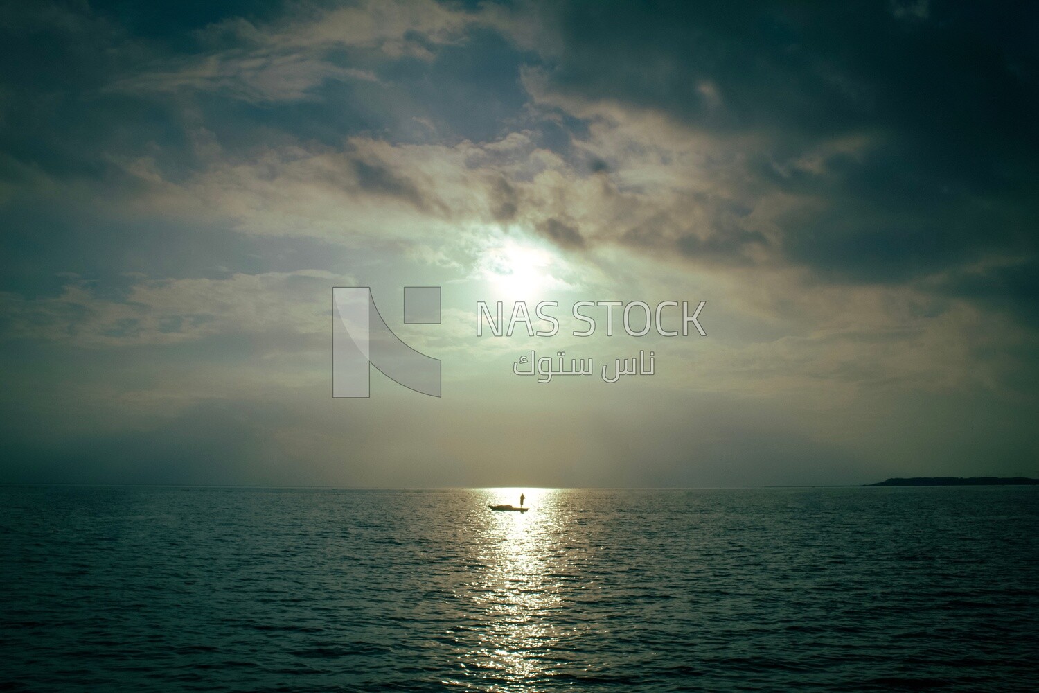 Burullus lakes during sunset, a fishing boat is in the middle of its waters