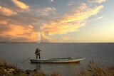 Fisherman drives a boat into the Burullus sea