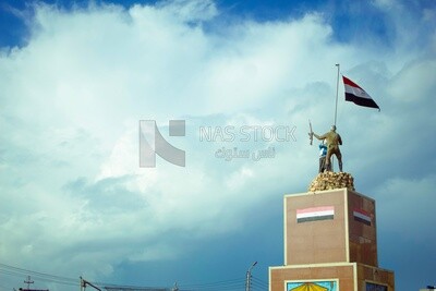 Statue of a soldier and a hunter holding the flag of Egypt