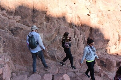 Tourists descending to the foot of the mountain