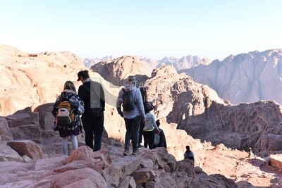 Tourists descending to the foot of the mountain