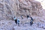 Tourists descending to the foot of the mountain