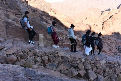Tourists descending to the foot of the mountain