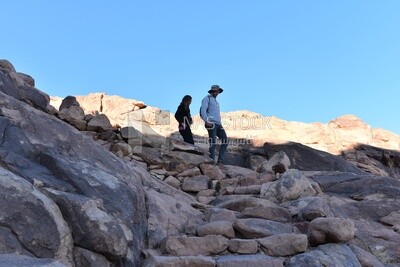 Tourists descending to the foot of the mountain