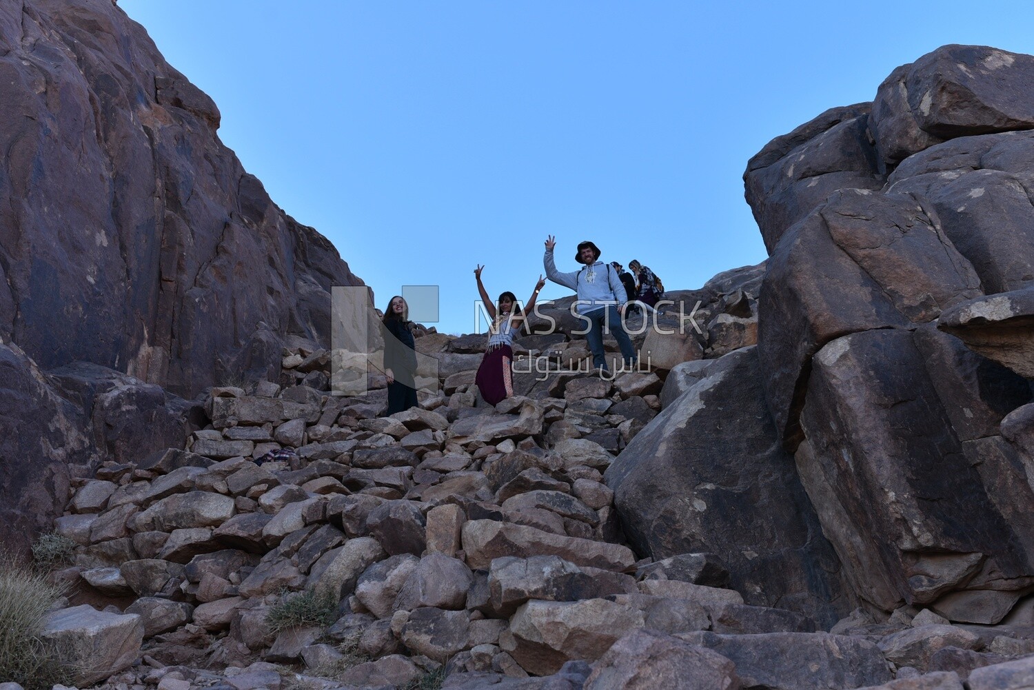 Tourists are happy with a mountain climbing trip
