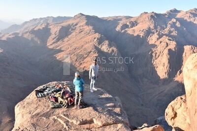 Couple camping on one of the mountain peaks