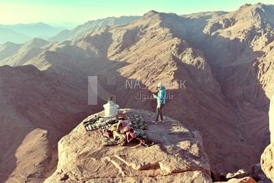 Couple camping on one of the mountain peaks