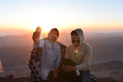 Couple taking selfies during a camping trip