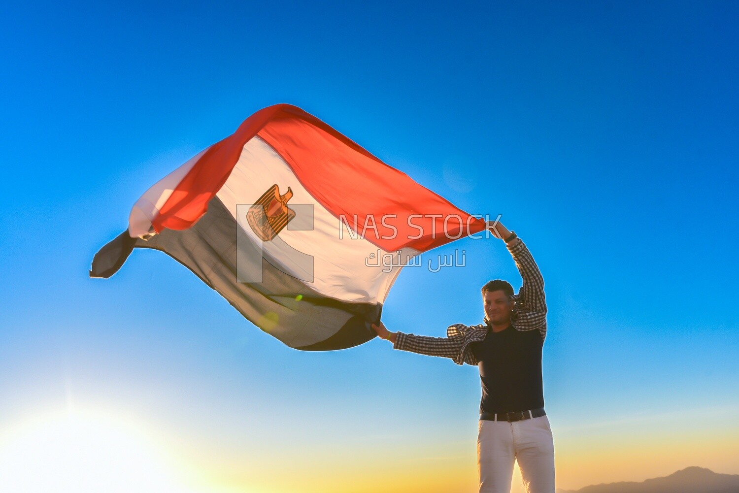 Man raises the Egyptian flag