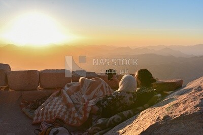 Couple camping on one of the mountain peaks in Sinai , Egypt