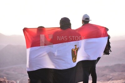 Group of tourists carrying the Egyptian flag
