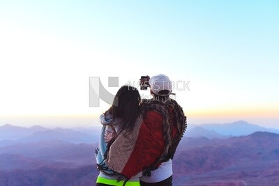 Couple taking selfies during a camping trip