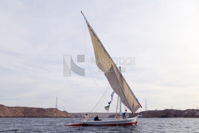 Sailboat sailing on the Nile River in Aswan, Egypt.
