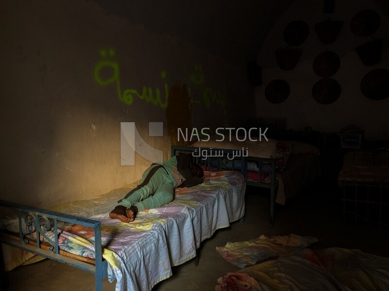 Poor man sleeping in a poor house, Aswan, Egypt