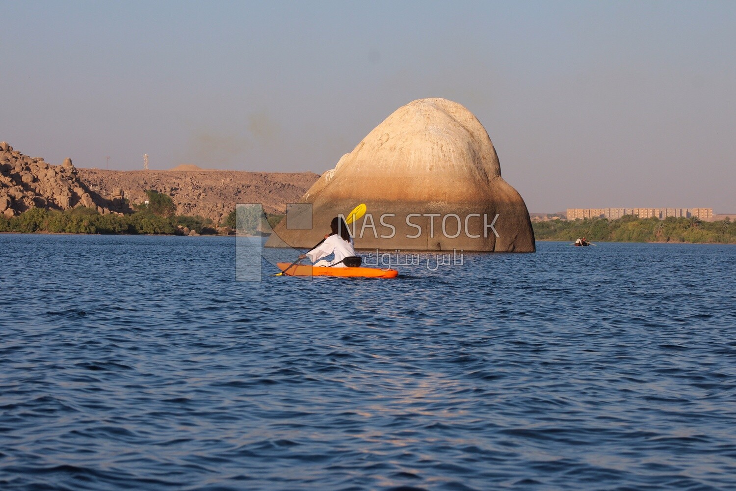 Girl enjoys paddling on the Nile River in Aswan, Egypt