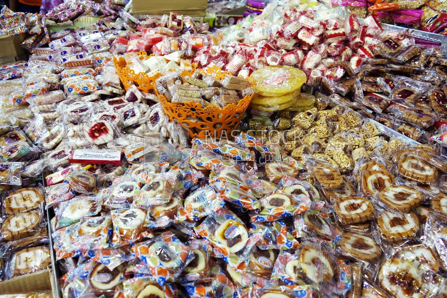 View of Collection of Arabian Sweet Candies with Nuts, Peanuts, Hazelnuts, and Pistachios in the Street, Egyptian Desserts of Prophet Muhammad&#39;s Birth Celebration