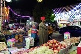 Man standing selling the candies of the prophet Muhammad&#39;s birth in the street